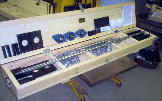 Photo of American Machine Tools Q150-XLS Portable Line Boring Shaft and Equipment in transport box with dolly wheels.