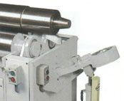 Heavy duty drop end is tilted hydraulically at the outboard end of the top roll journal for easy removal of your finished part.